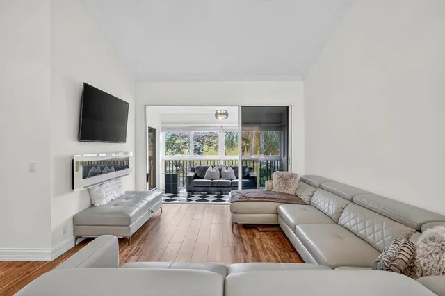 a living room with furniture or couch and a large window