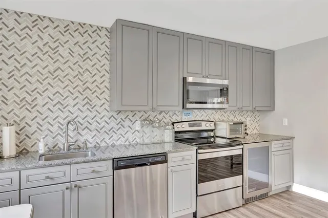 an aerial view of residential houses with city view