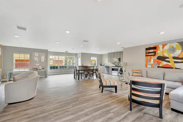 an aerial view of residential houses with city view