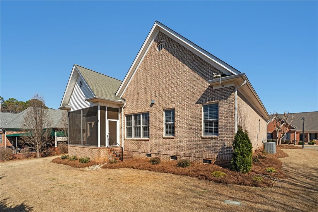 38 Angus Run Seneca, SC 29672 - Photo 37 of 46 This charming brick home features a cozy screened porch, perfect for enjoying tranquil moments outdoors.