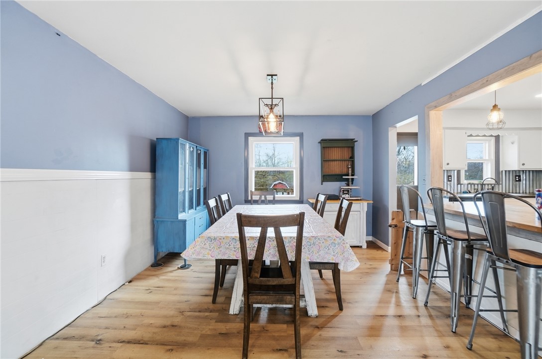290 Ginghamsburg Road Tipp City, OH 45371 - Photo 11 of 49 This spacious dining area features hardwood floors and ample natural light, ideal for gatherings.