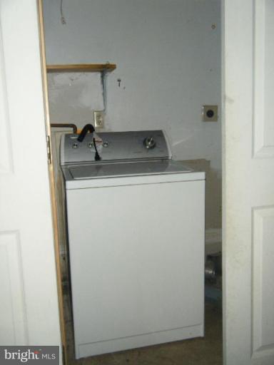 987 Crystal Rock Road Lusby, MD 20657 - Photo 12 of 14 a utility room with dryer and washer