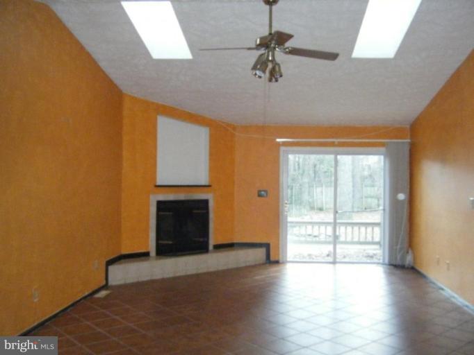 987 Crystal Rock Road Lusby, MD 20657 - Photo 3 of 14 a view of an empty room with a window