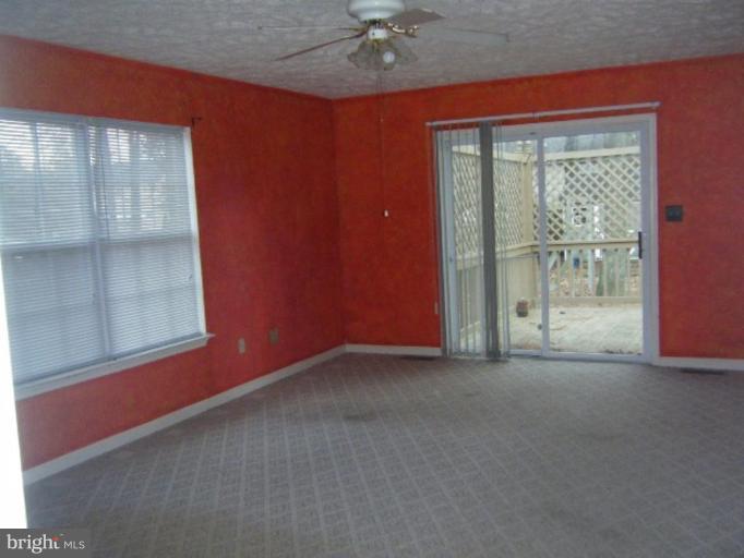 987 Crystal Rock Road Lusby, MD 20657 - Photo 5 of 14 an empty room with a window