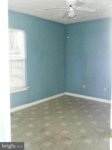 987 Crystal Rock Road Lusby, MD 20657 - Photo 7 of 14 an empty room with a window