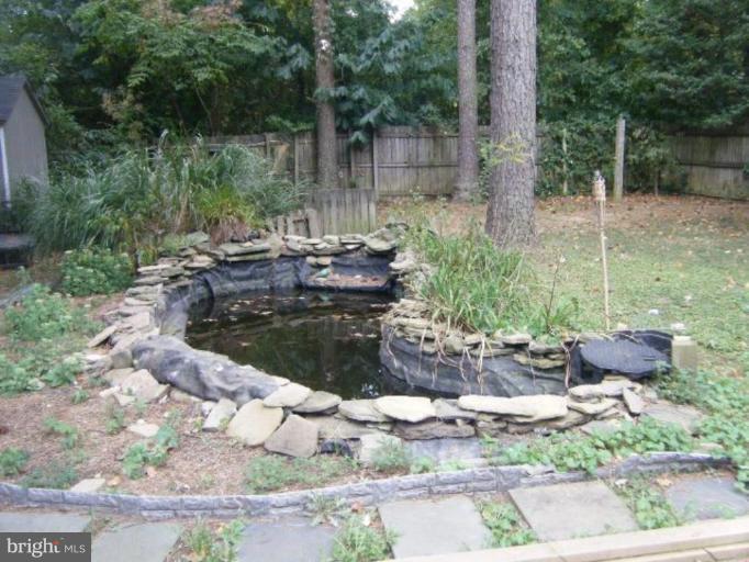 987 Crystal Rock Road Lusby, MD 20657 - Photo 10 of 14 a view of a backyard with sitting area
