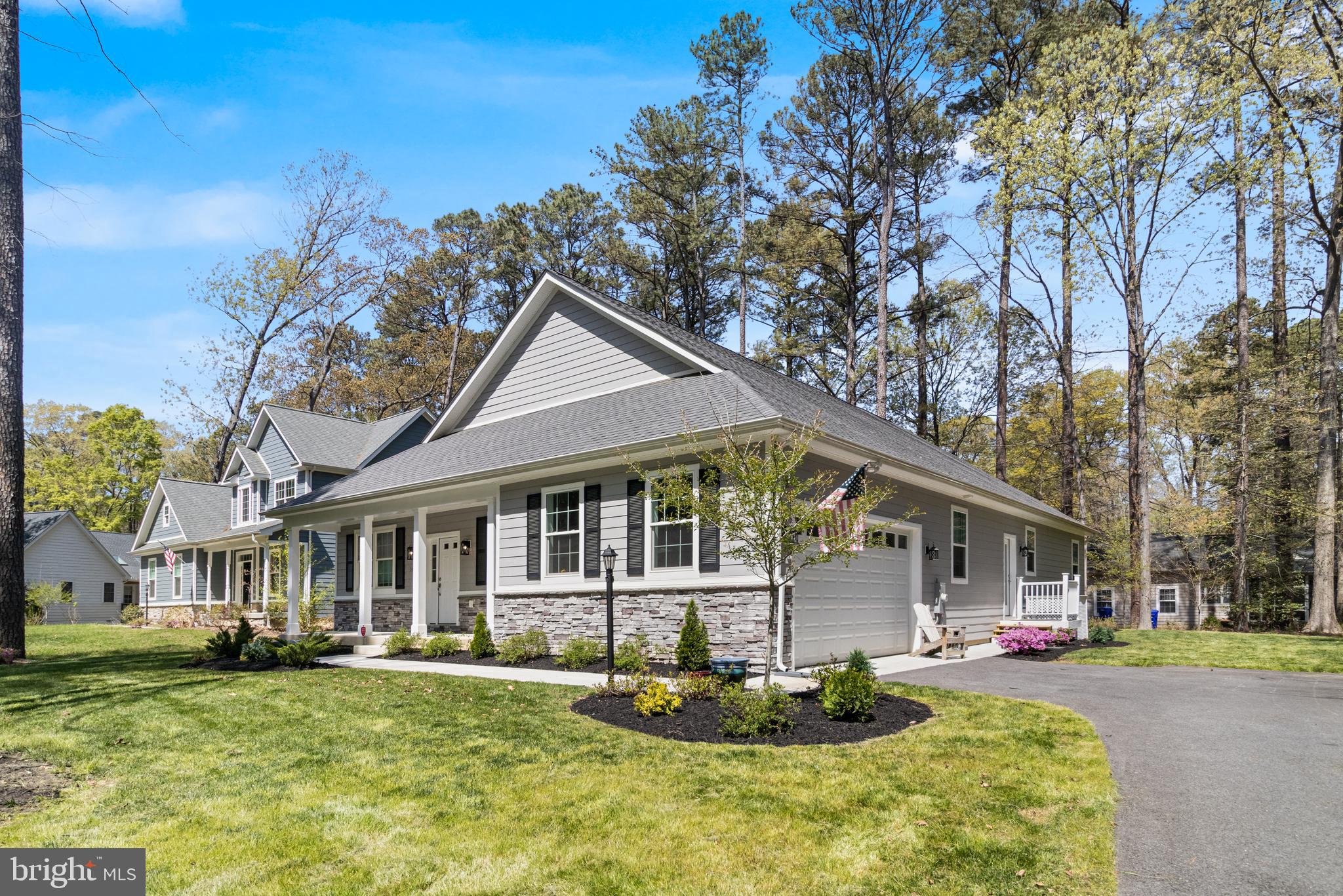 14730 Locust Court Swan Point, MD 20645 - Photo 26 of 30 a front view of a house with a porch