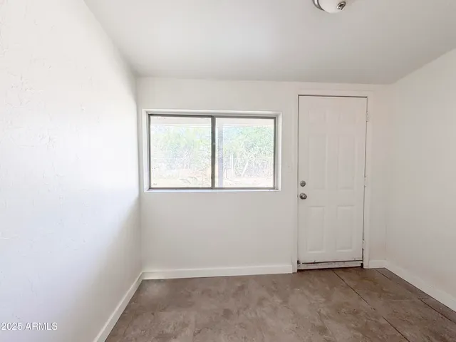 a kitchen with cabinets stainless steel appliances and a sink