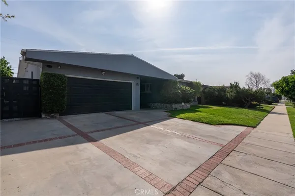 a view of backyard with outdoor space