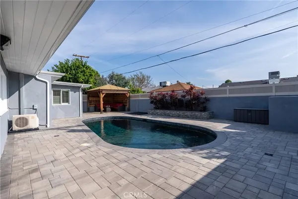 a view of backyard and entertaining space