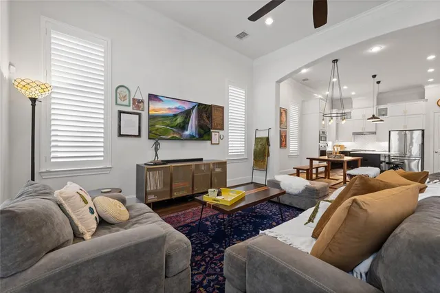 a room with gym equipment and wooden floor