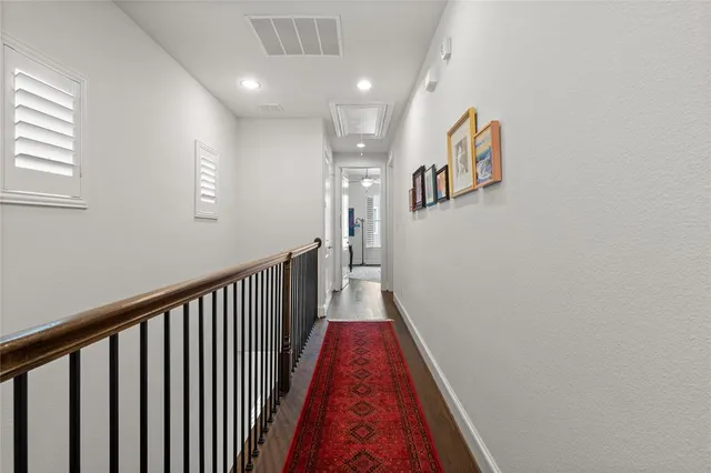 a kitchen with a refrigerator a stove and cabinets