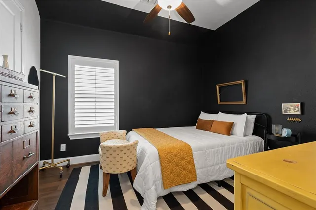 a bathroom with a toilet a sink and a mirror