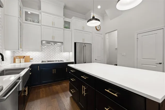 a kitchen with a sink and cabinets