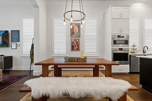 a view of a floor to ceiling window and potted plant in front of a window