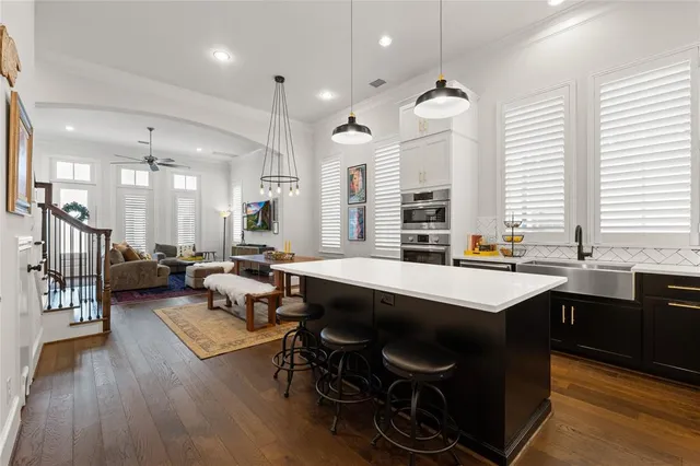 a large kitchen with lots of counter space and a sink