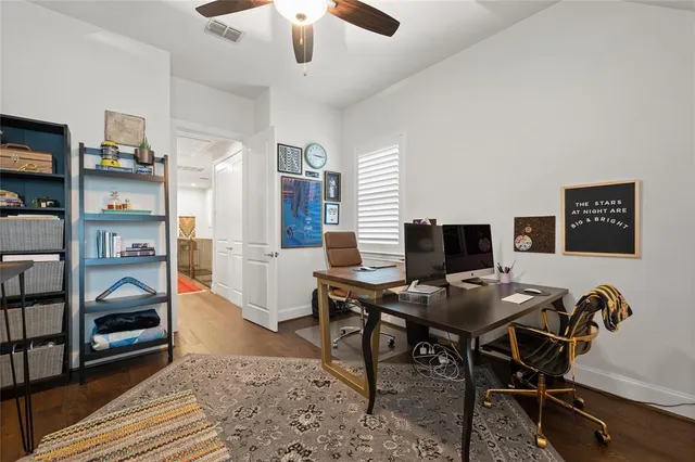 a view of a dining room with furniture and a window