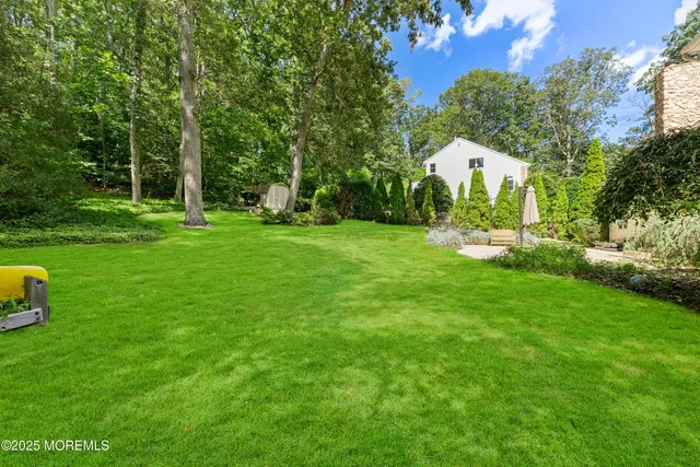 a view of a garden with a building in the background