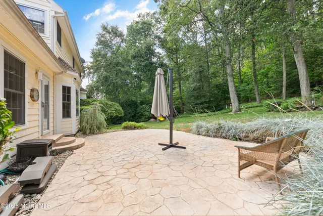 a room with pool table and windows