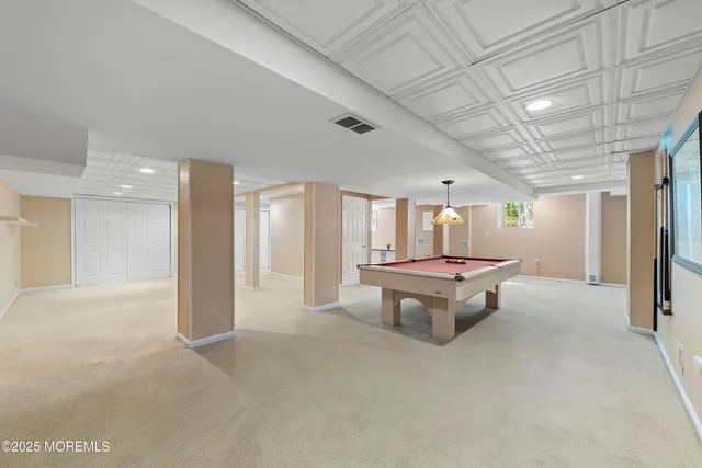 an aerial view of a house with garden space and street view