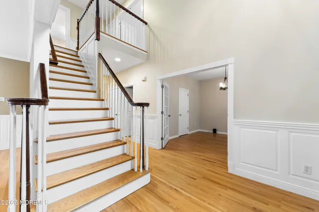 a view of entryway with wooden floor
