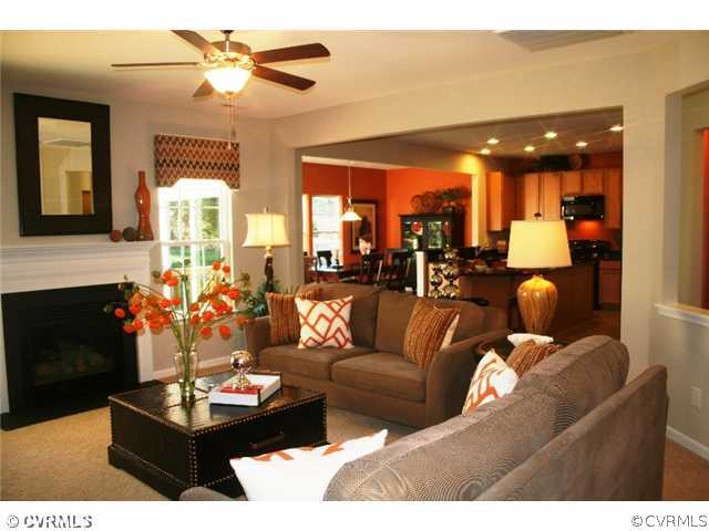 10737 Ethens Mill Road Chester, VA 23831 - Photo 2 of 10 a living room with furniture and a fireplace