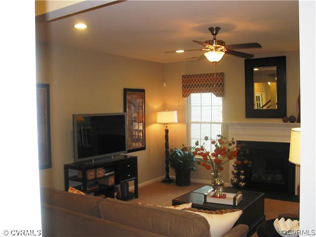 10737 Ethens Mill Road Chester, VA 23831 - Photo 4 of 10 a living room with furniture and a flat screen tv