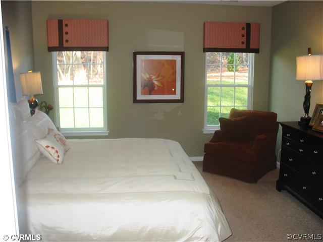 10737 Ethens Mill Road Chester, VA 23831 - Photo 7 of 10 a bedroom with a bed and two windows