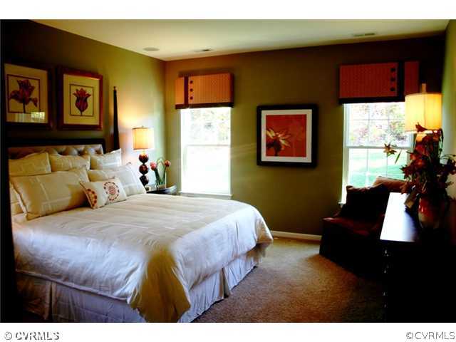 10737 Ethens Mill Road Chester, VA 23831 - Photo 8 of 10 a bedroom with a bed and wooden floor