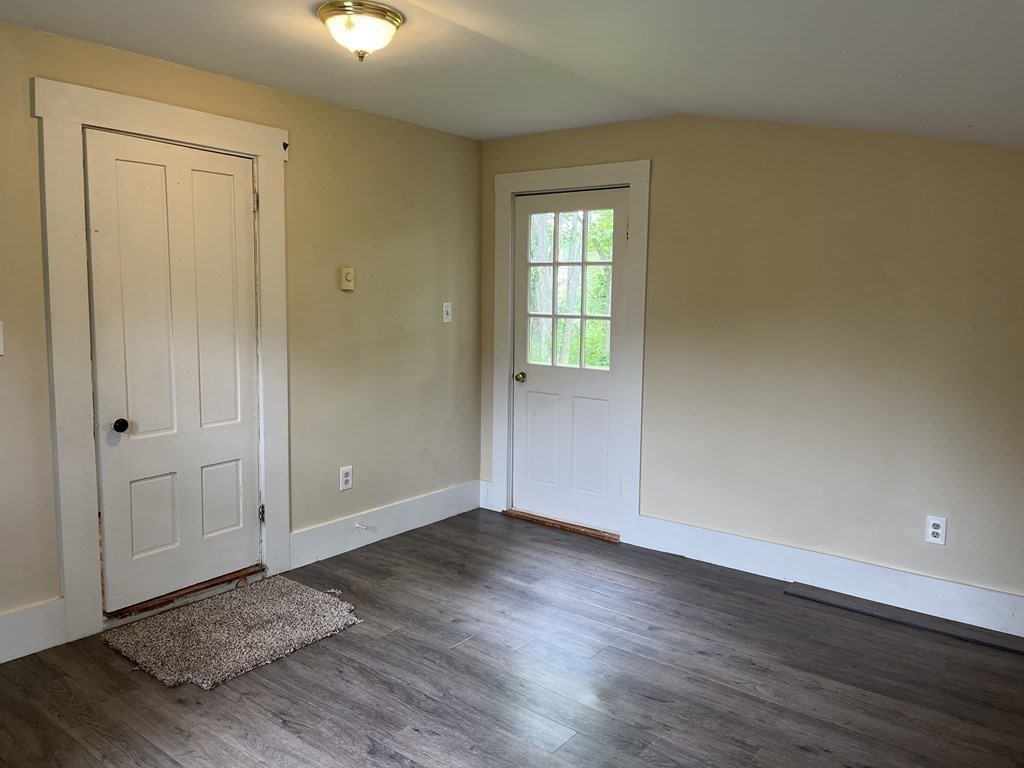 634 Patriots Road Templeton, MA 01468 - Photo 11 of 26 a view of an empty room with window and wooden floor