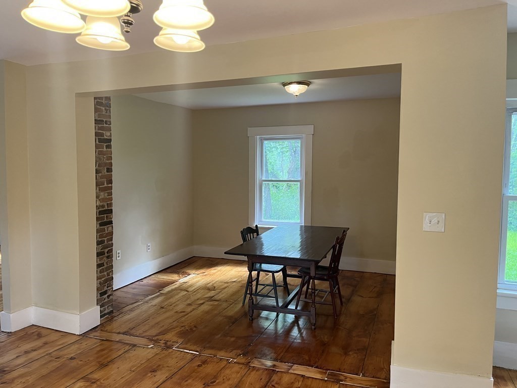 634 Patriots Road Templeton, MA 01468 - Photo 13 of 26 a view of a dining room with furniture and wooden floor