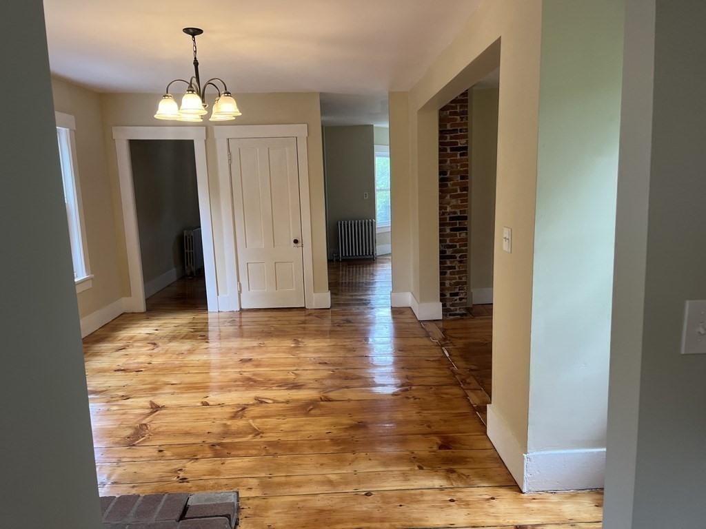 634 Patriots Road Templeton, MA 01468 - Photo 15 of 26 a view of a room with wooden floor and windows