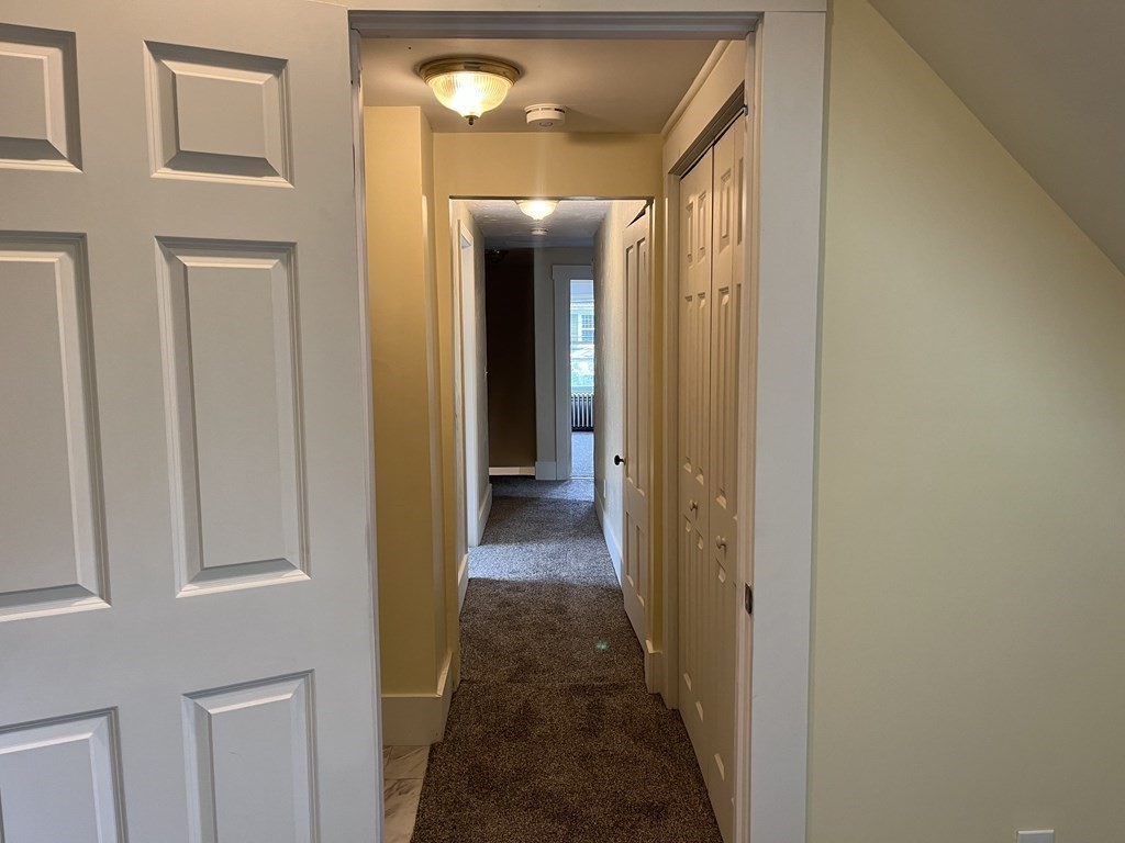 634 Patriots Road Templeton, MA 01468 - Photo 19 of 26 a view of a hallway with wooden floor