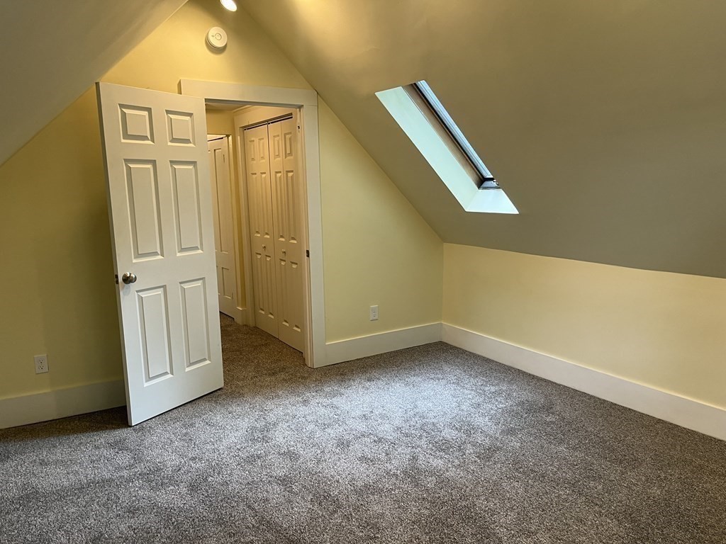 634 Patriots Road Templeton, MA 01468 - Photo 20 of 26 an empty room with a door