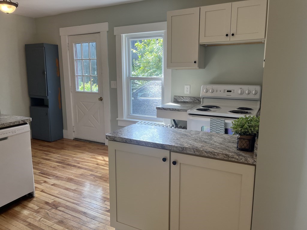 634 Patriots Road Templeton, MA 01468 - Photo 7 of 26 a kitchen with stainless steel appliances granite countertop a sink stove and cabinets