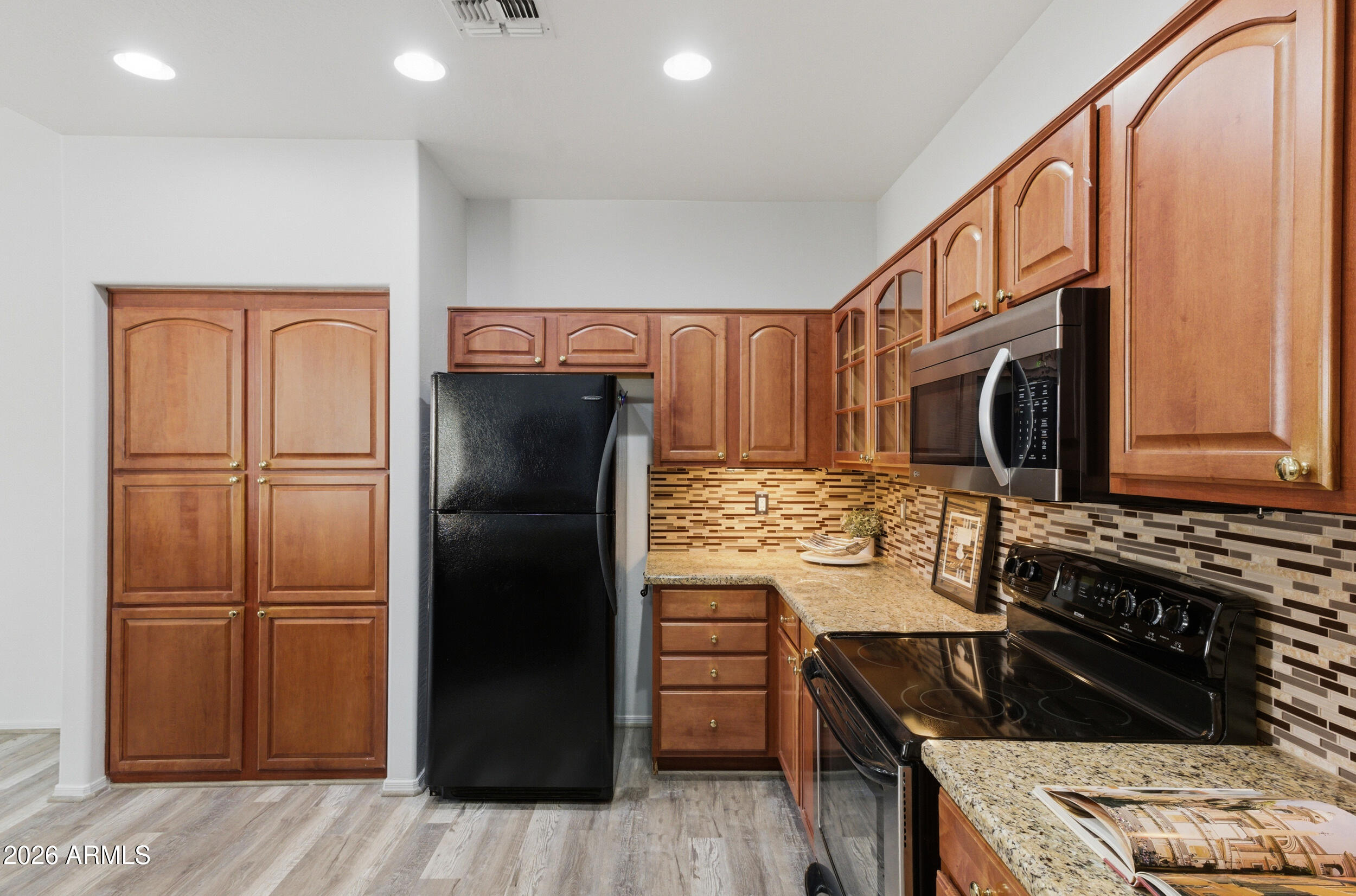 1024 East Frye Road, Unit 1060 Phoenix, AZ 85048 - Photo 10 of 41 a kitchen with stainless steel appliances granite countertop a refrigerator and a stove top oven