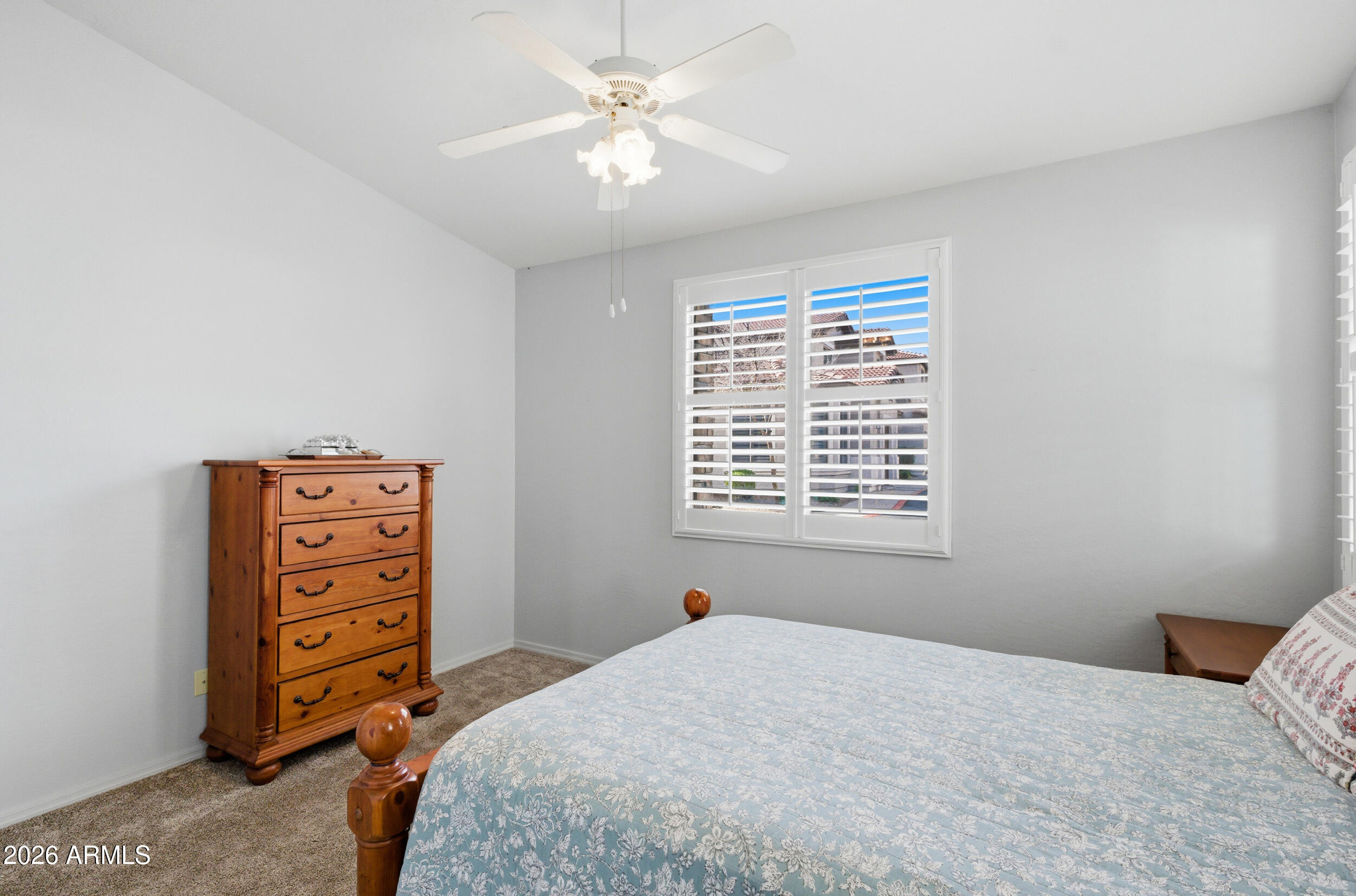 1024 East Frye Road, Unit 1060 Phoenix, AZ 85048 - Photo 17 of 41 a bedroom with a bed a dresser and a window