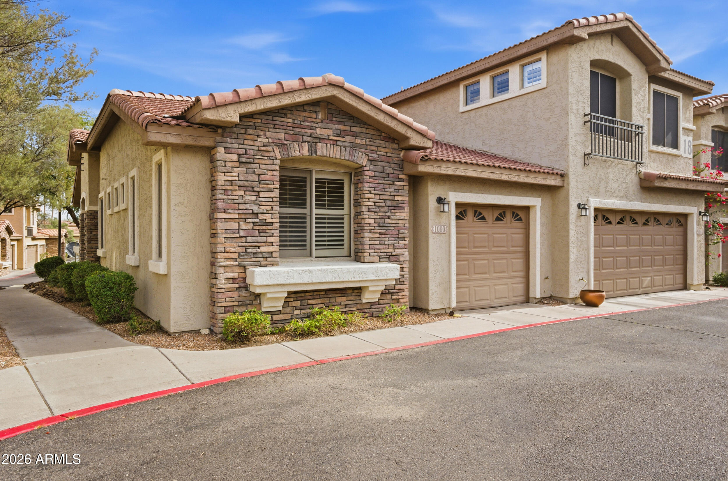 1024 East Frye Road, Unit 1060 Phoenix, AZ 85048 - Photo 2 of 41 a front view of a house with a garage