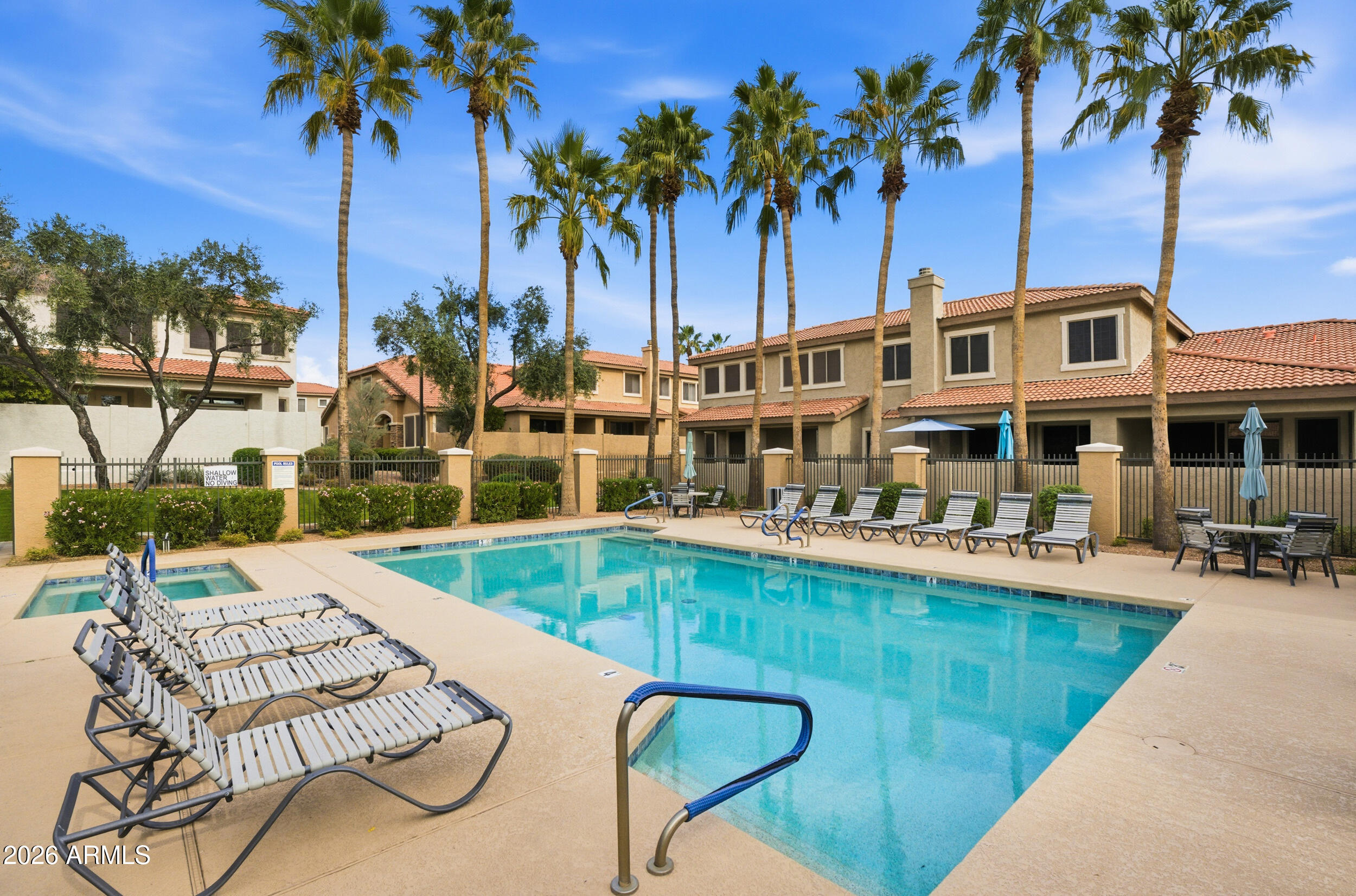 1024 East Frye Road, Unit 1060 Phoenix, AZ 85048 - Photo 27 of 41 a view of a swimming pool with a table and chairs