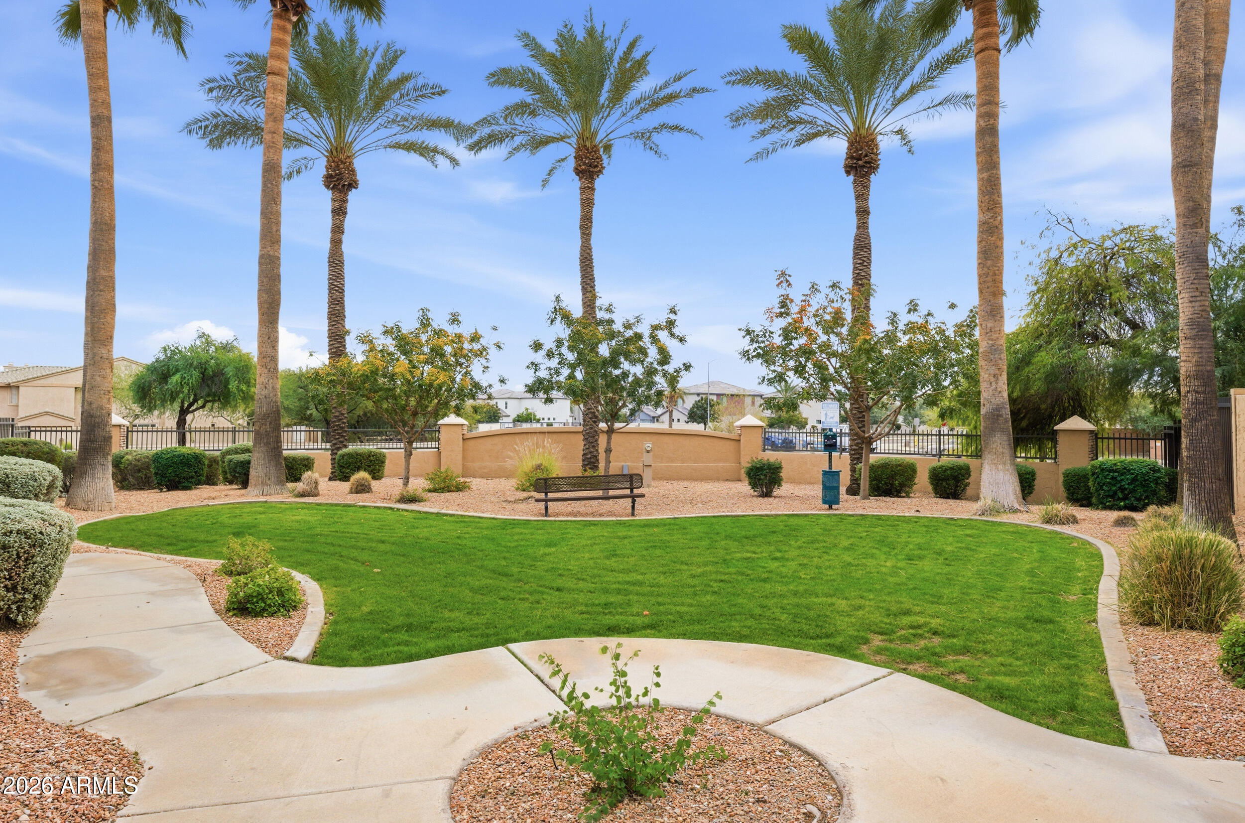 1024 East Frye Road, Unit 1060 Phoenix, AZ 85048 - Photo 33 of 41 a view of a white house with a big yard and potted plants