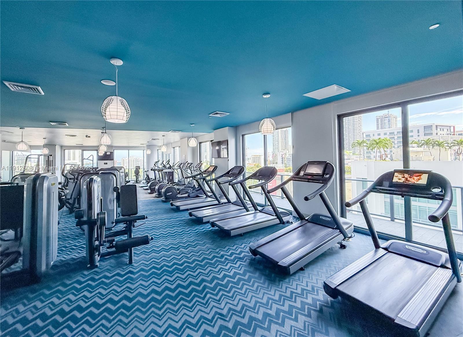 121 Northeast 34th Street, Unit 2003 Miami, FL 33137 - Photo 19 of 27 a view of a room with gym equipment