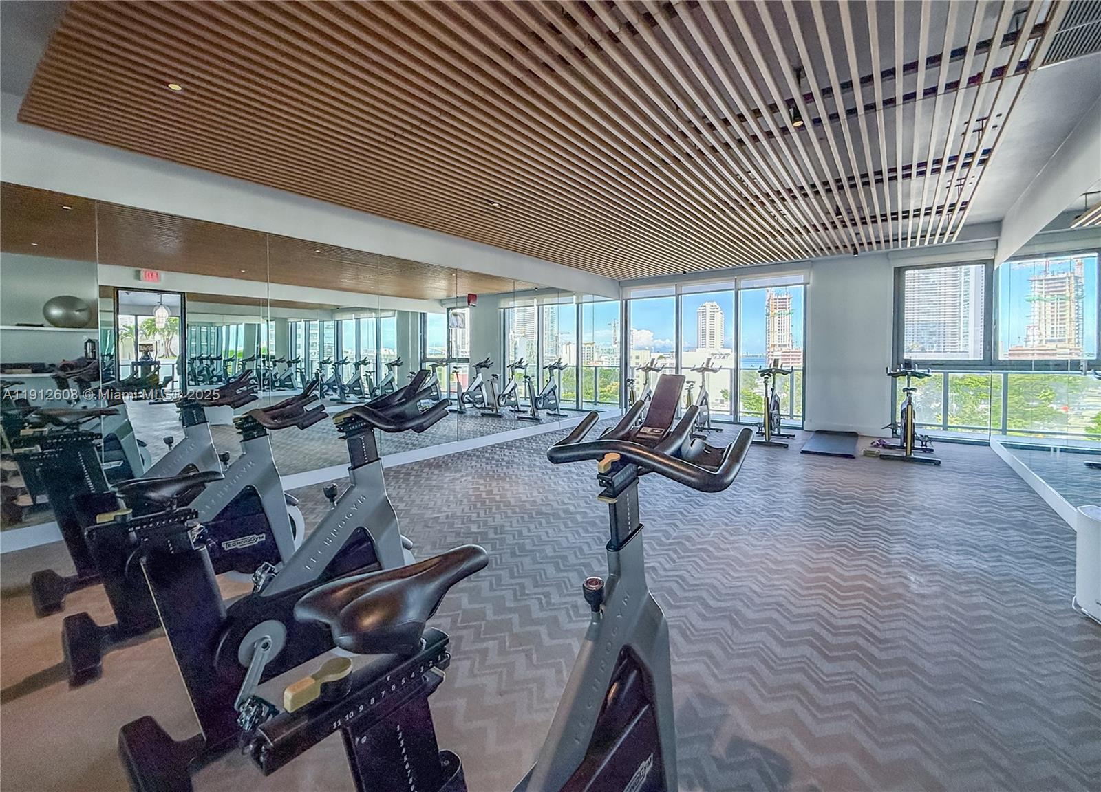 121 Northeast 34th Street, Unit 2003 Miami, FL 33137 - Photo 20 of 27 a view of a room with gym equipment
