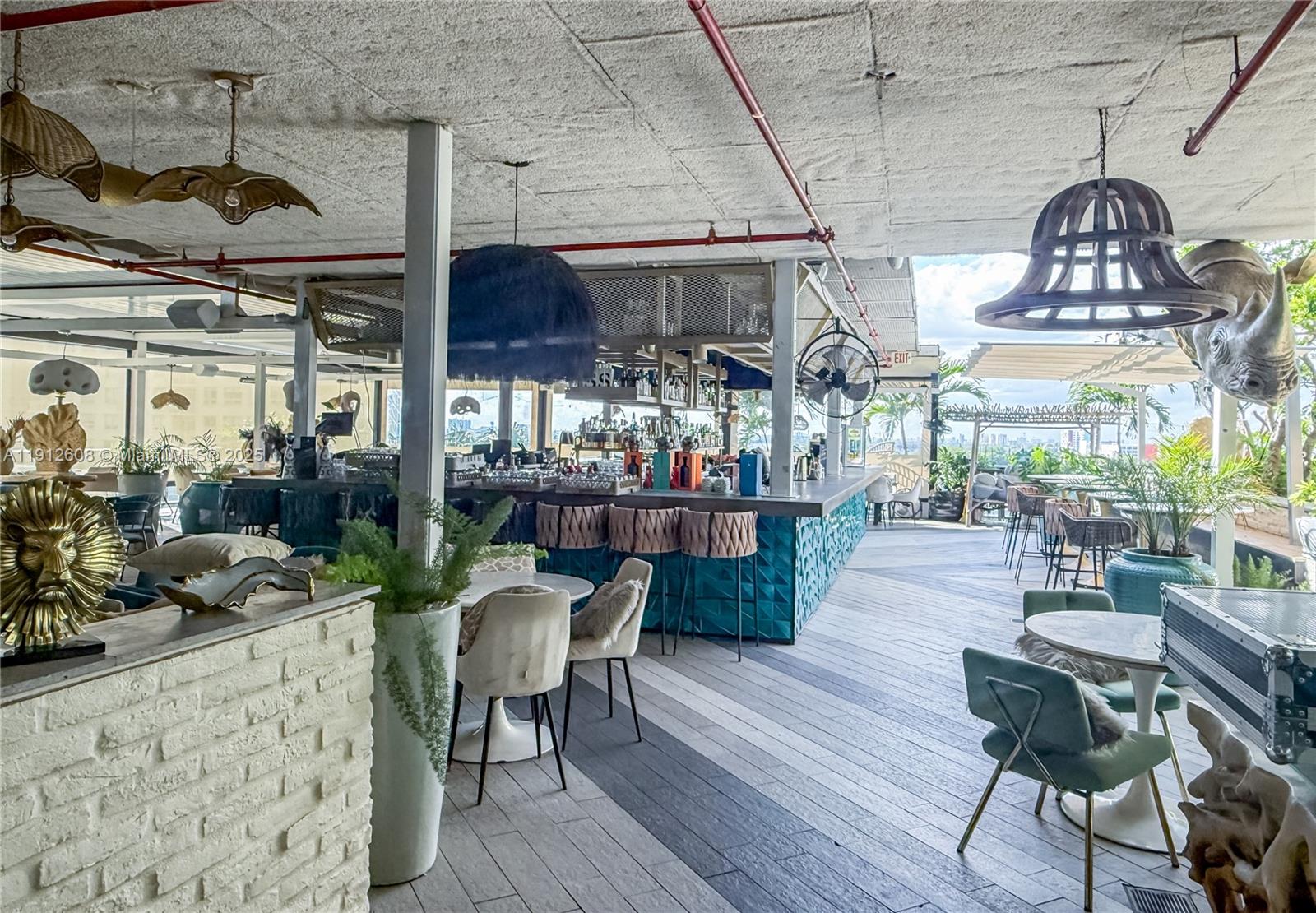 121 Northeast 34th Street, Unit 2003 Miami, FL 33137 - Photo 26 of 27 a view of a dining room with furniture window and wooden floor