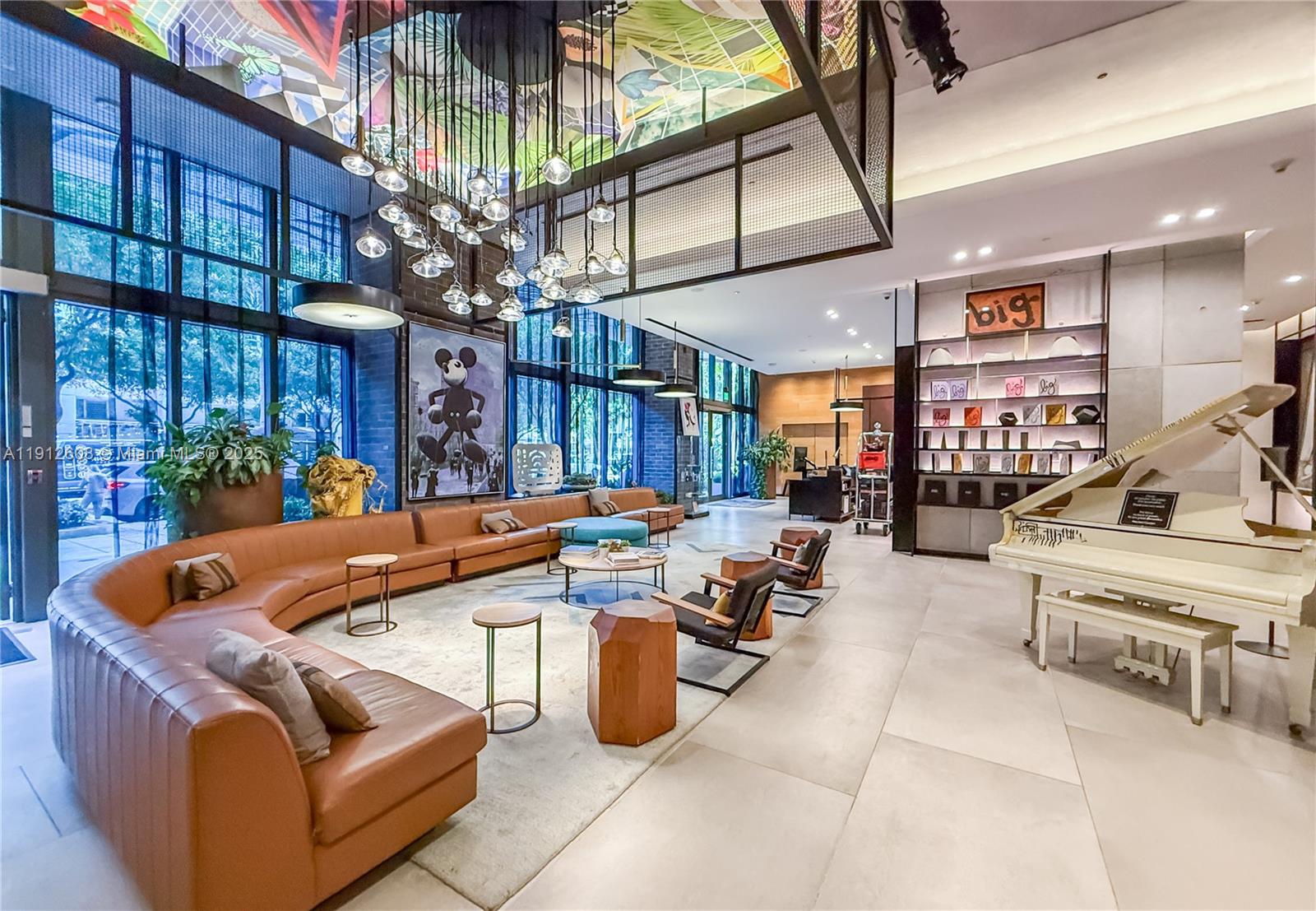 121 Northeast 34th Street, Unit 2003 Miami, FL 33137 - Photo 27 of 27 a living room with furniture a chandelier and fireplace