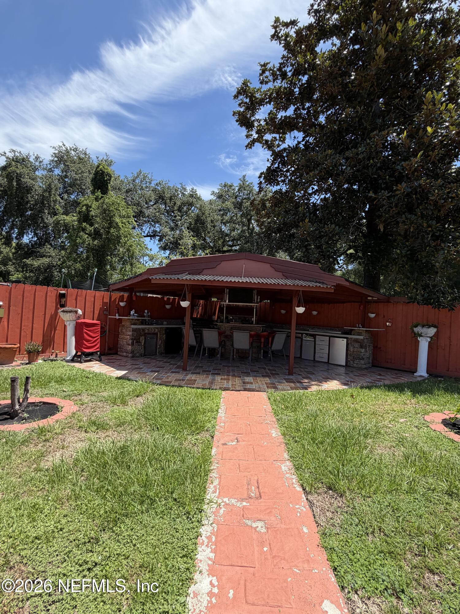 4127 Springwood Road Jacksonville, FL 32207 - Photo 50 of 63 a view of house with backyard space and garden