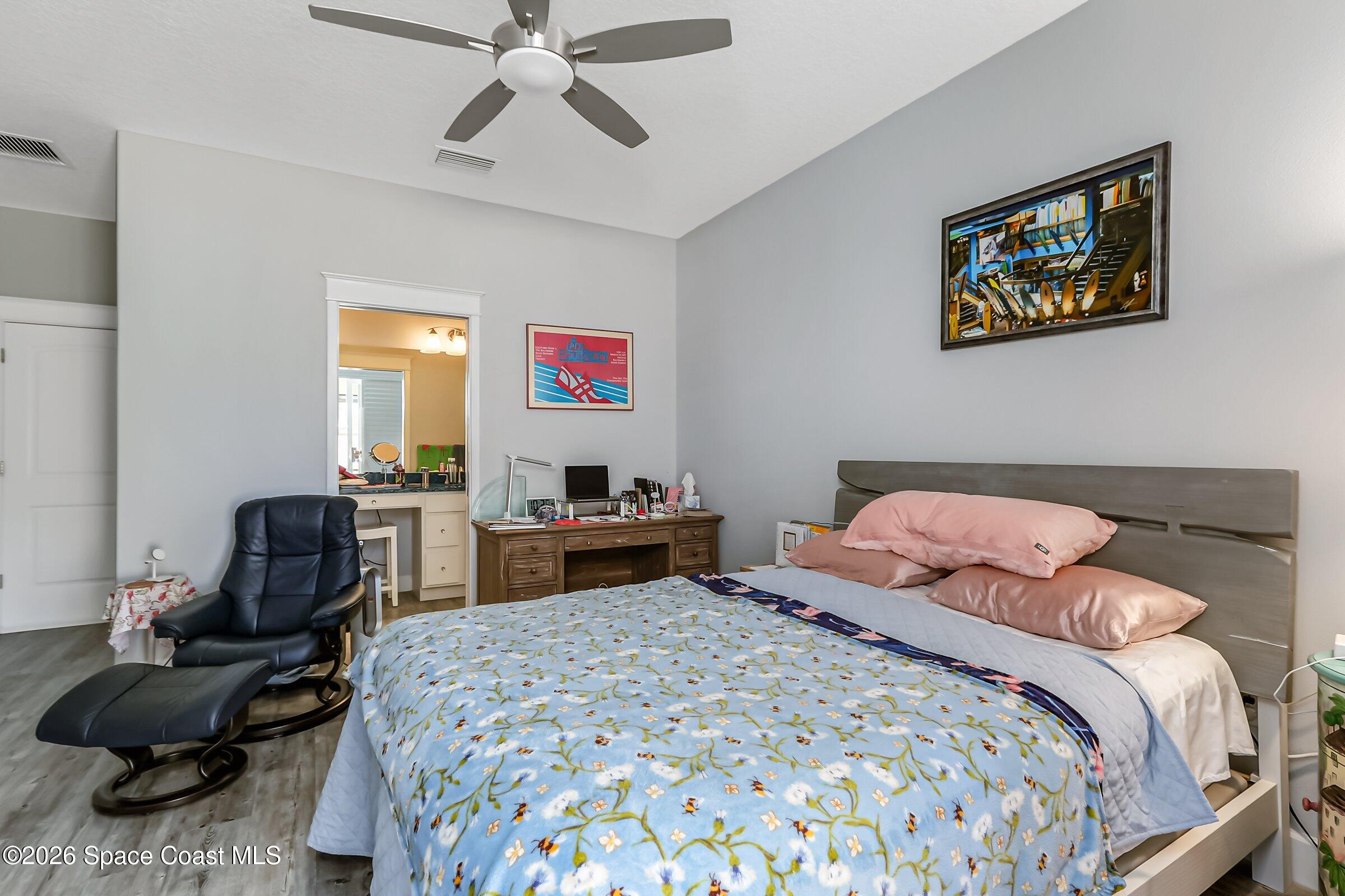 1399 Tullagee Avenue Melbourne, FL 32940 - Photo 19 of 53 a bedroom with a bed and furniture