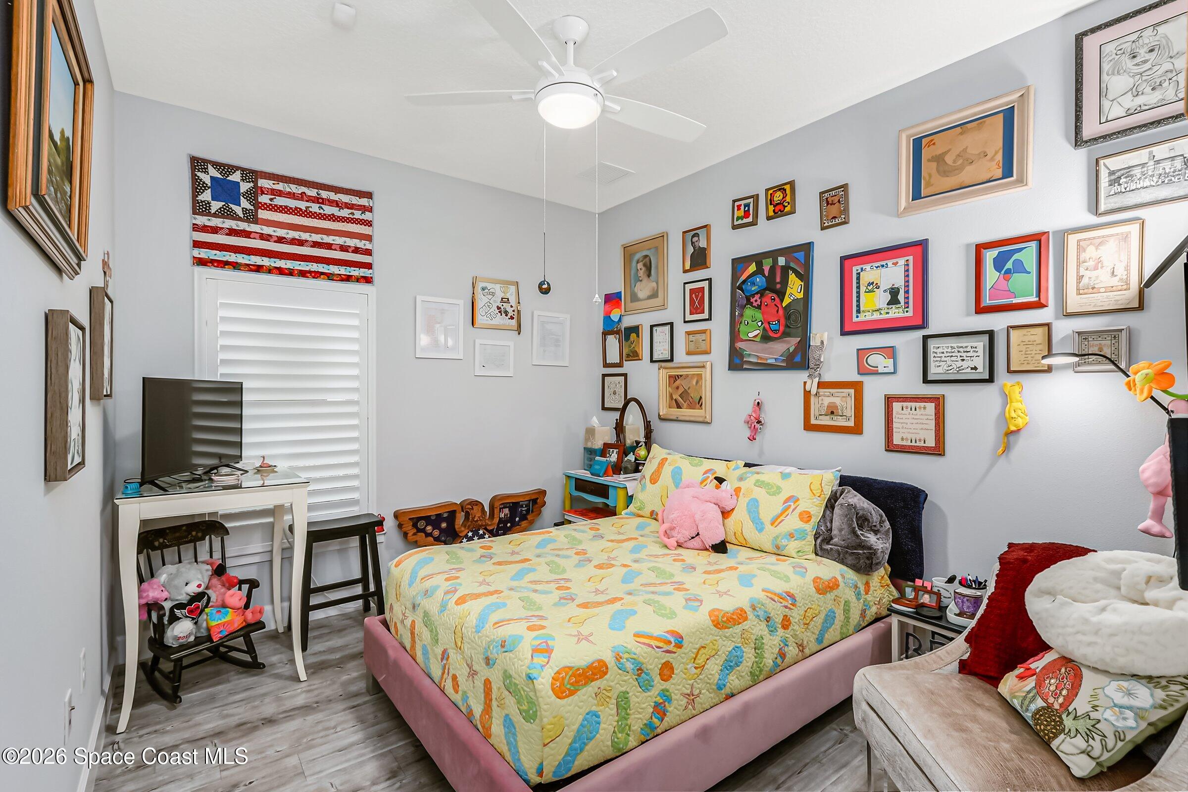 1399 Tullagee Avenue Melbourne, FL 32940 - Photo 29 of 53 a bedroom with a bed workspace and a window