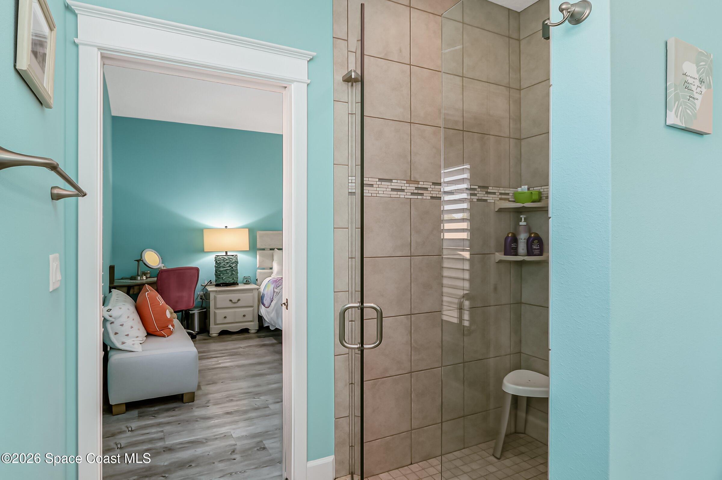 1399 Tullagee Avenue Melbourne, FL 32940 - Photo 31 of 53 a bathroom with a toilet and a shower