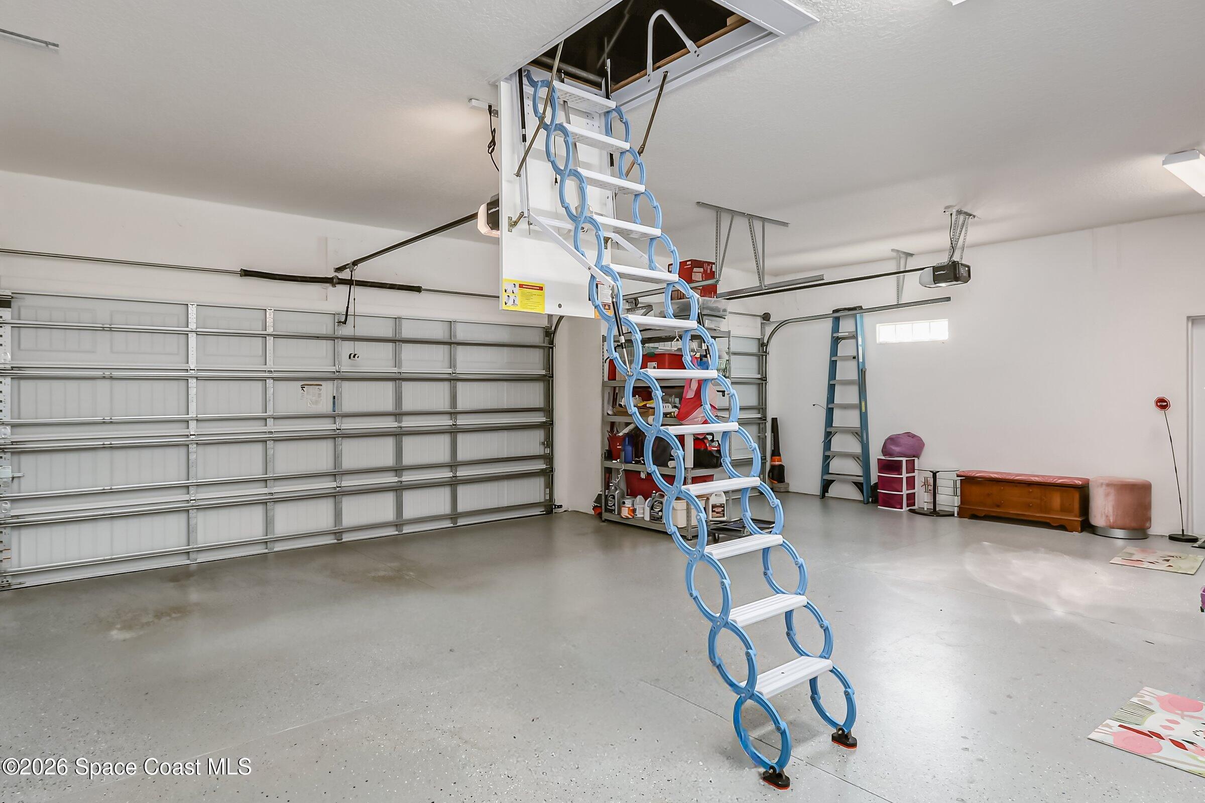 1399 Tullagee Avenue Melbourne, FL 32940 - Photo 32 of 53 a view of a garage with storage