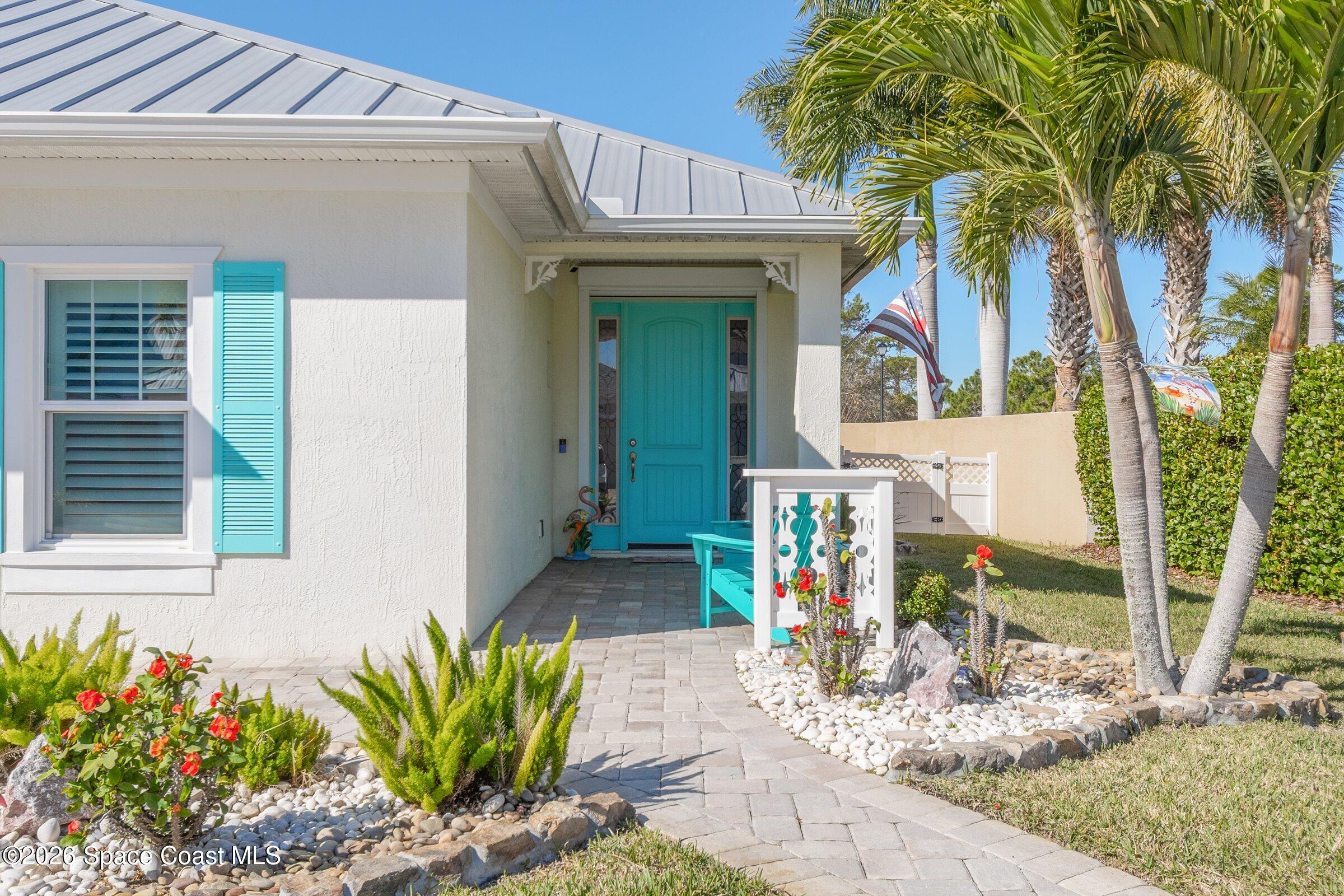 1399 Tullagee Avenue Melbourne, FL 32940 - Photo 6 of 53 a front view of a house with garden
